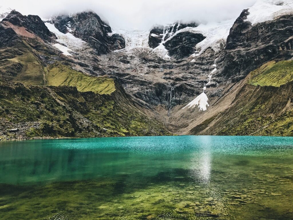 Serene Humantay Lake surrounded by the snow-capped mountains