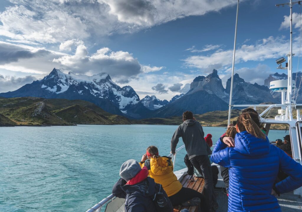 Hikers crossing Lake Pehoe on a catamaran to hike the W Circuit