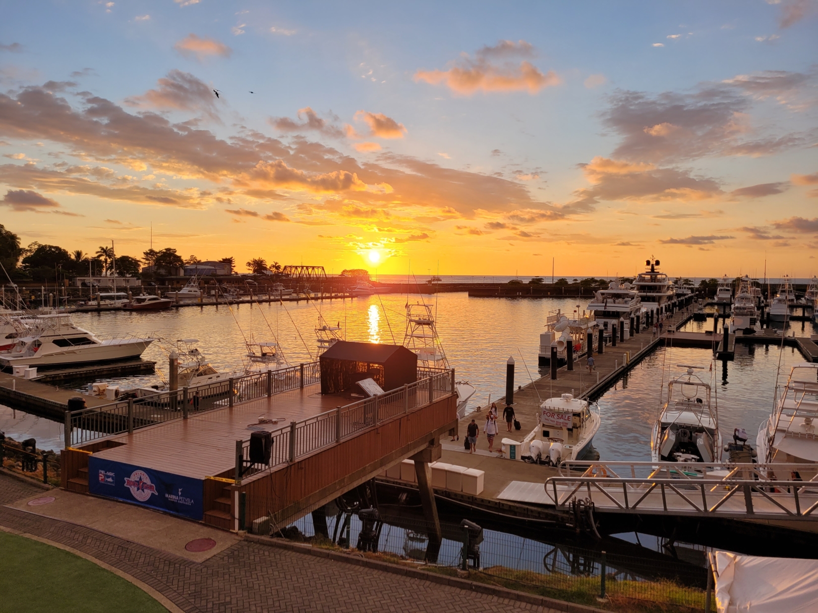 Sun setting over a marina in Quepos - the gateway to Manuel Antonio National Park in Costa Rica